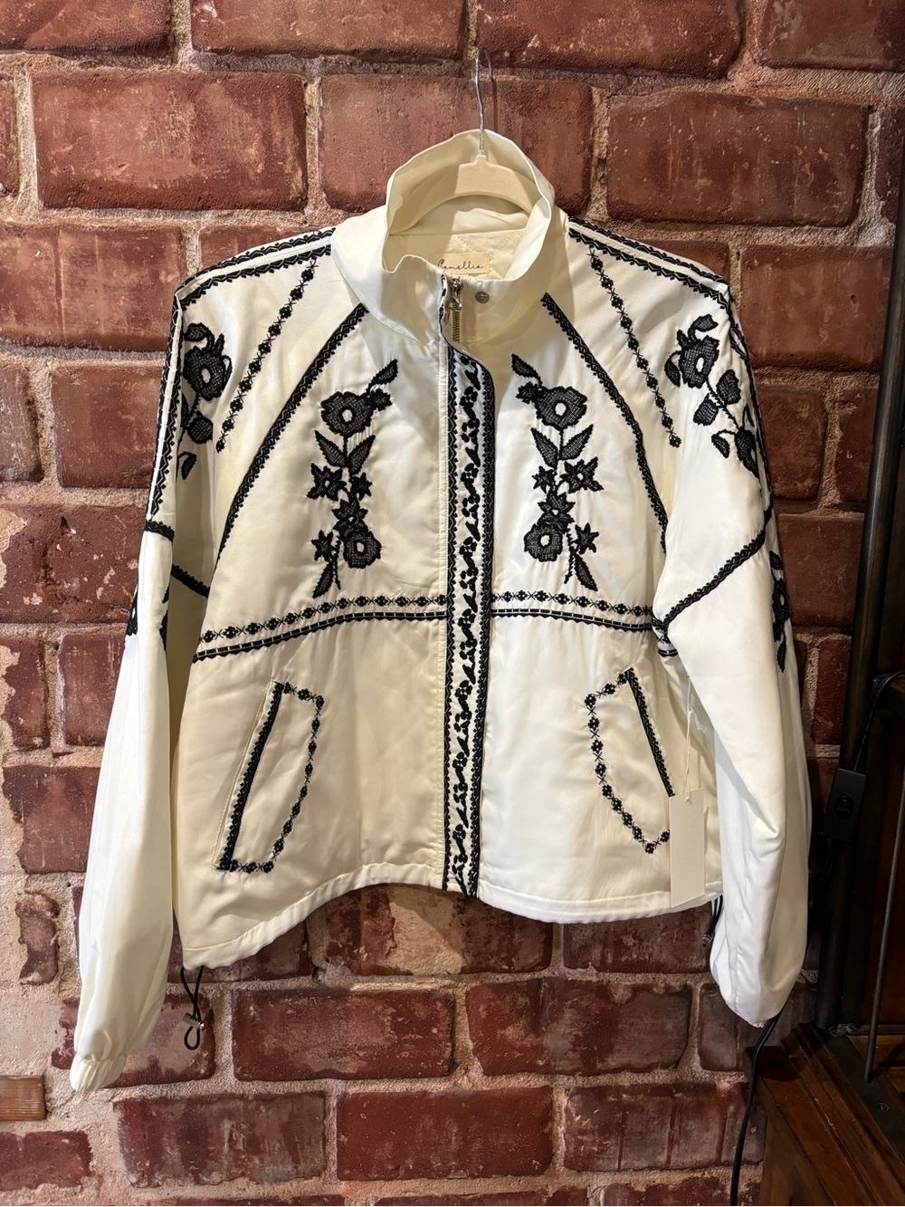 Embroidered White Bomber Jacket with Black Floral Trim